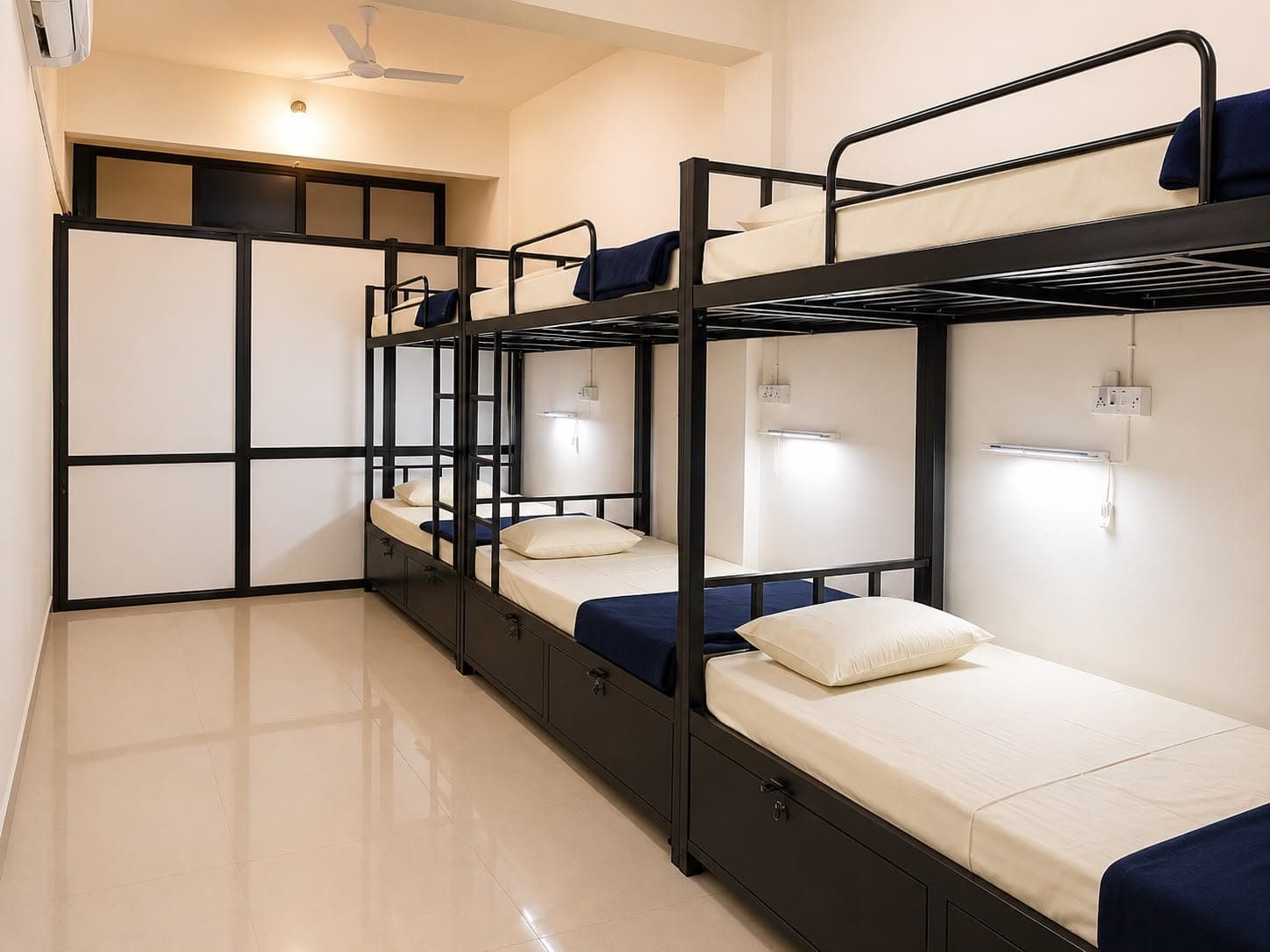 Boys' dormitory with bunk beds, a lockable drawer and a reading light for each bed