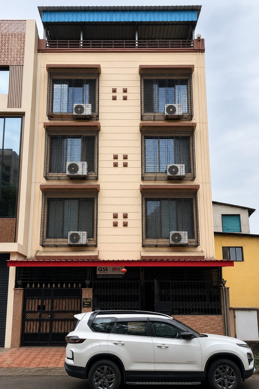 Front of the Om Shanti PG building in Sector 12, Kharghar, with air-conditioned rooms on every floor