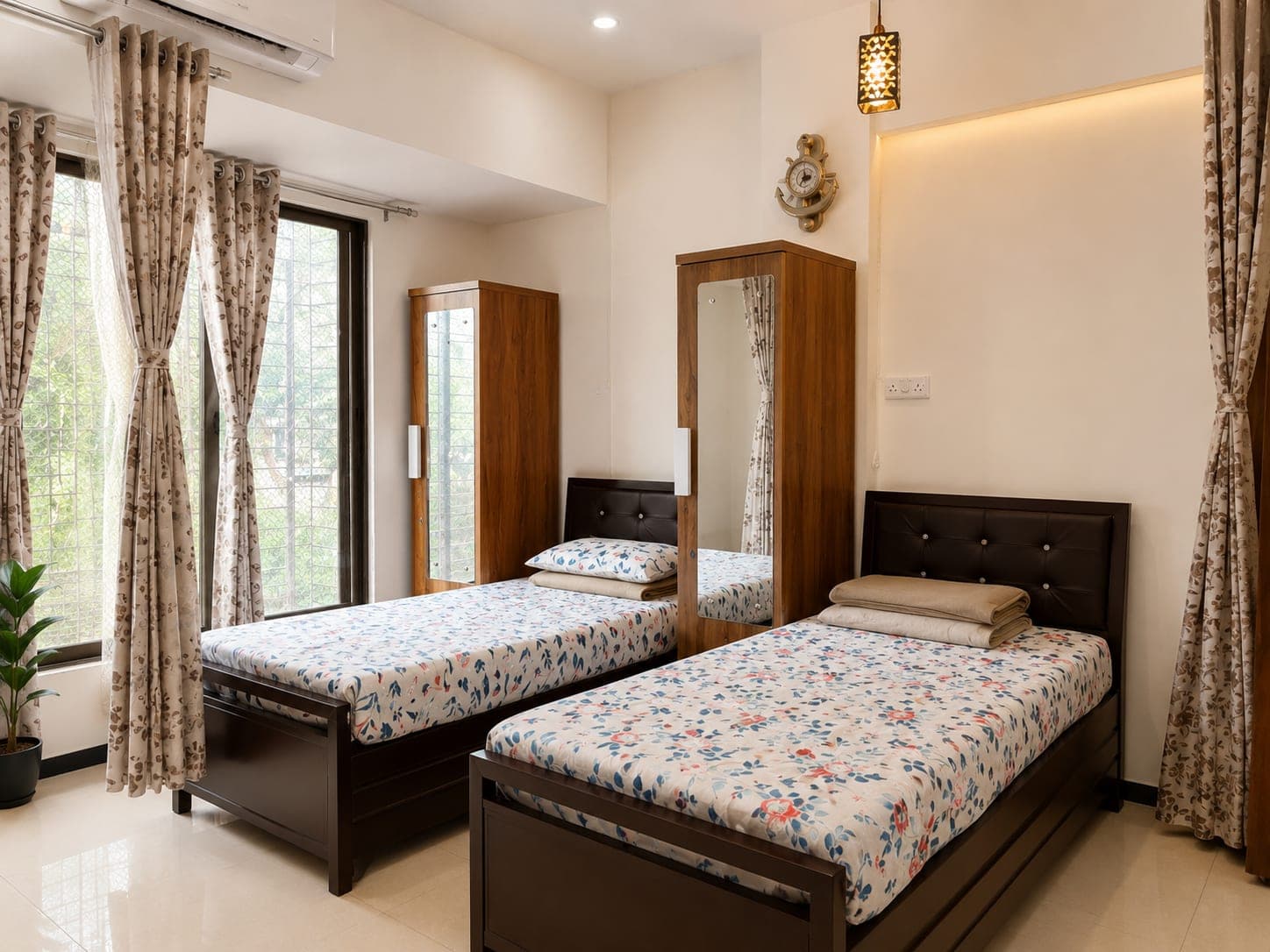 Double-sharing girls' room with a wardrobe and full-length mirror for each resident