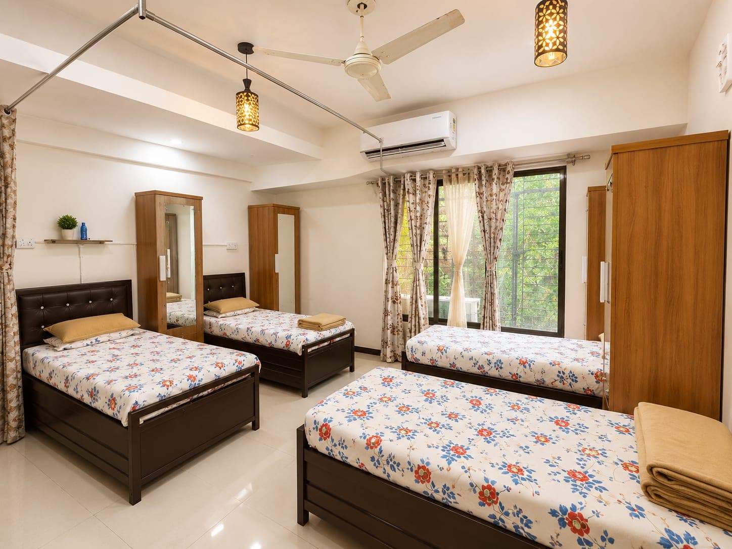 Four-sharing girls' room with AC, ceiling fan, wardrobes and a large window